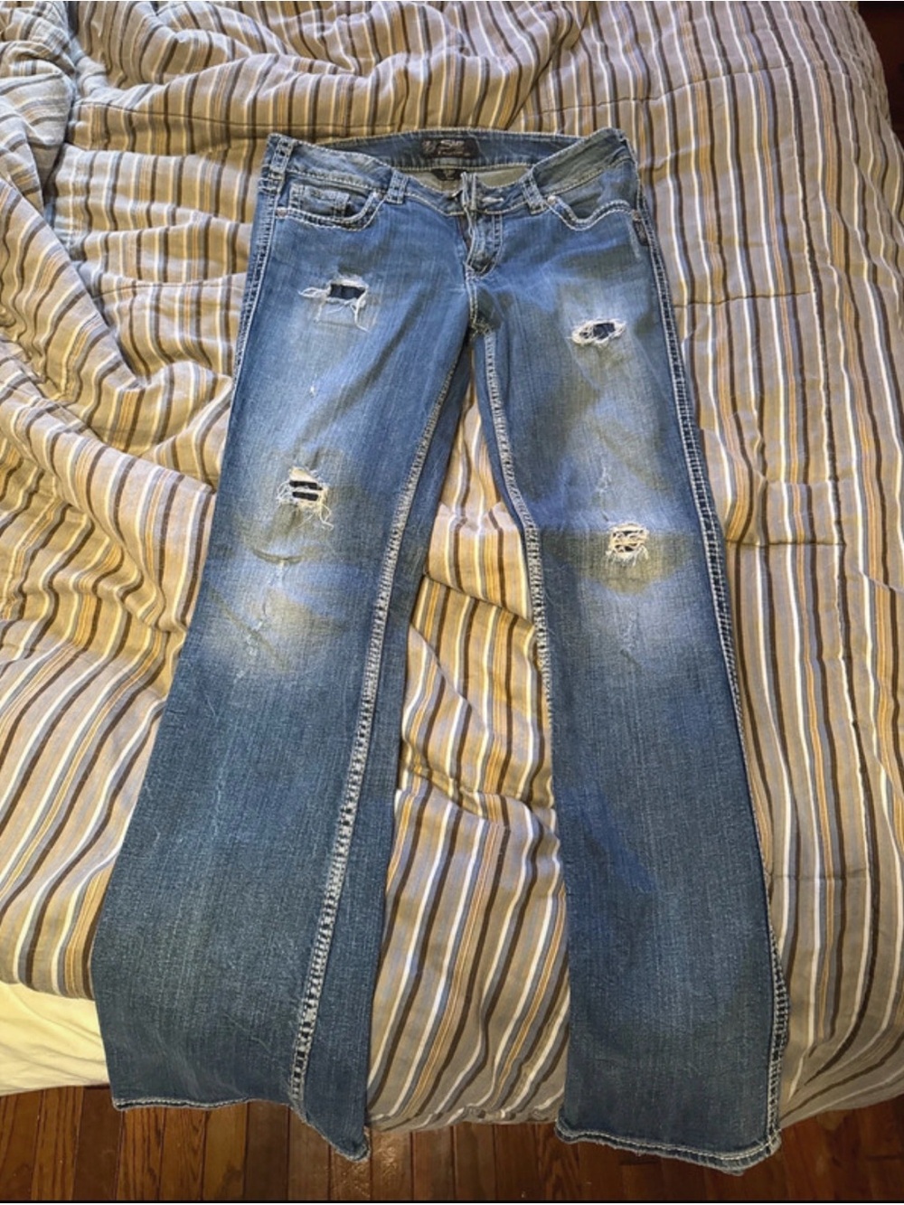 Silver Jeans Distressed Blue Flare Jeans